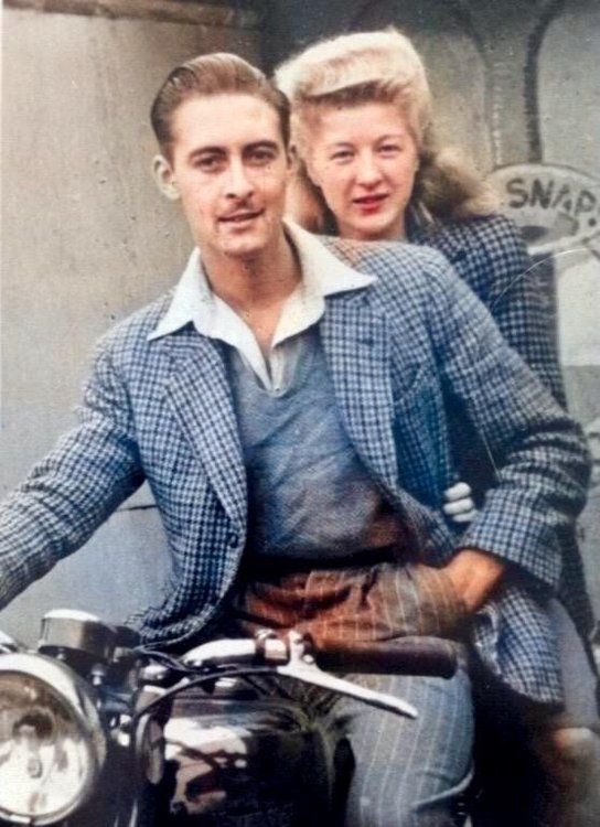 Dad and mum on motorbike.JPG