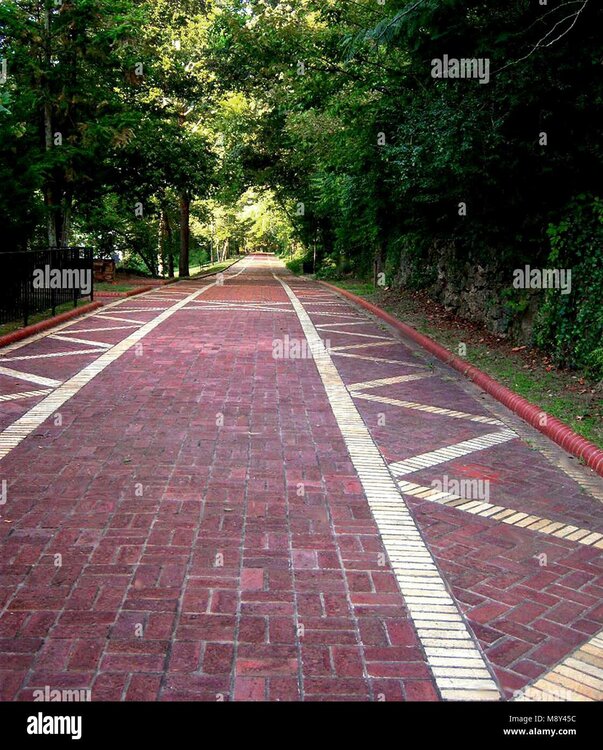 promenade-beautiful-walking-path-through-the-park-with-red-brick-pavers-M8Y45C.jpg